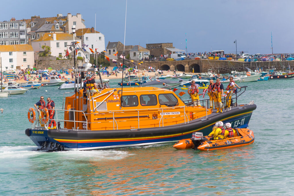The St Ives branch of the RNLI departing St Ives Harbour, one of the most famous harbours in Cornwall, the RNLI one of many great Cornish charities.