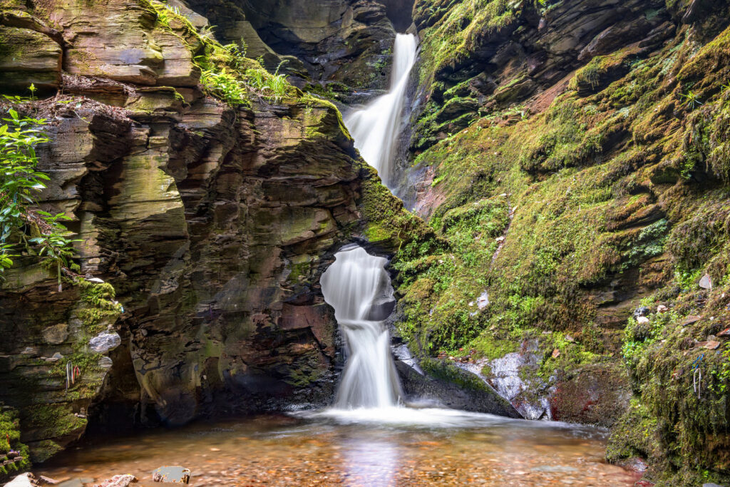 St Nectan's Kieve is a popular tourist destination with a stunning waterfall walk in Cornwall.