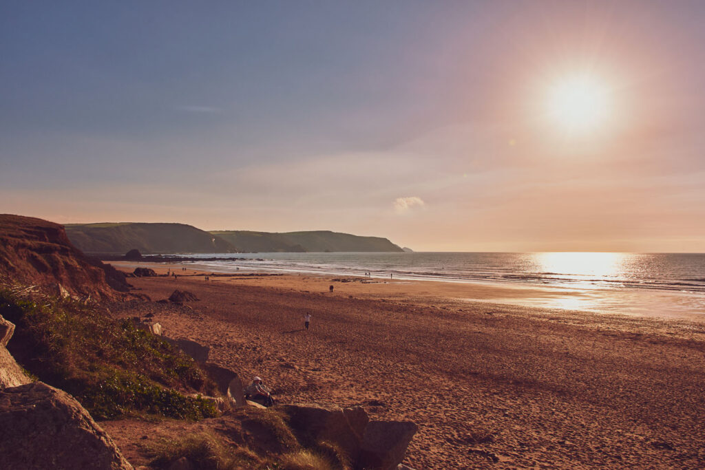 Widemouth Bay features a beautiful expanse of water, perfect for surfing and enjoying the coastal scenery of Cornwall.