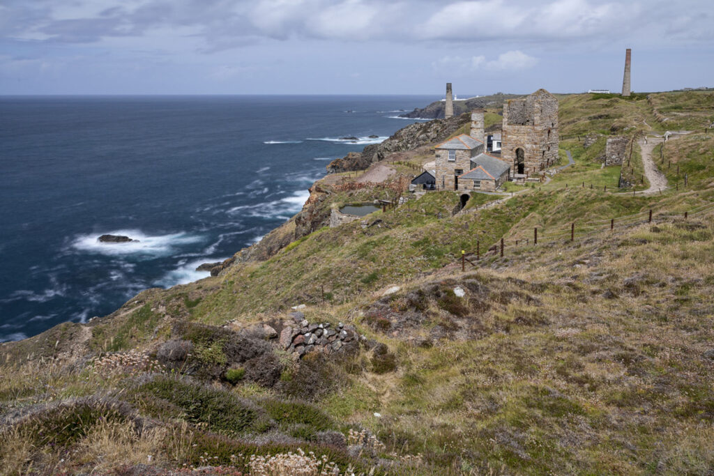A cliffside view featuring Levant Mine in West Cornwall, a locations that inspired many novels by Patrick Gale in Cornwall.