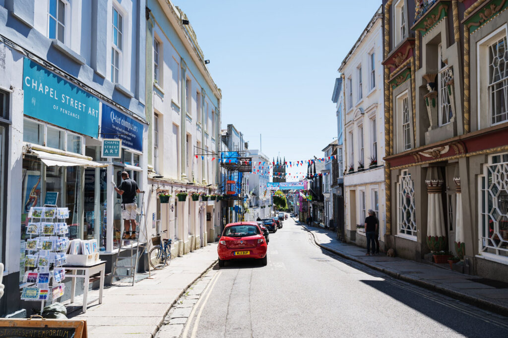 A white building with a blue roof, located on Chapel Street in Penzance, linked to the Bronte sisters' literary inspiration.
