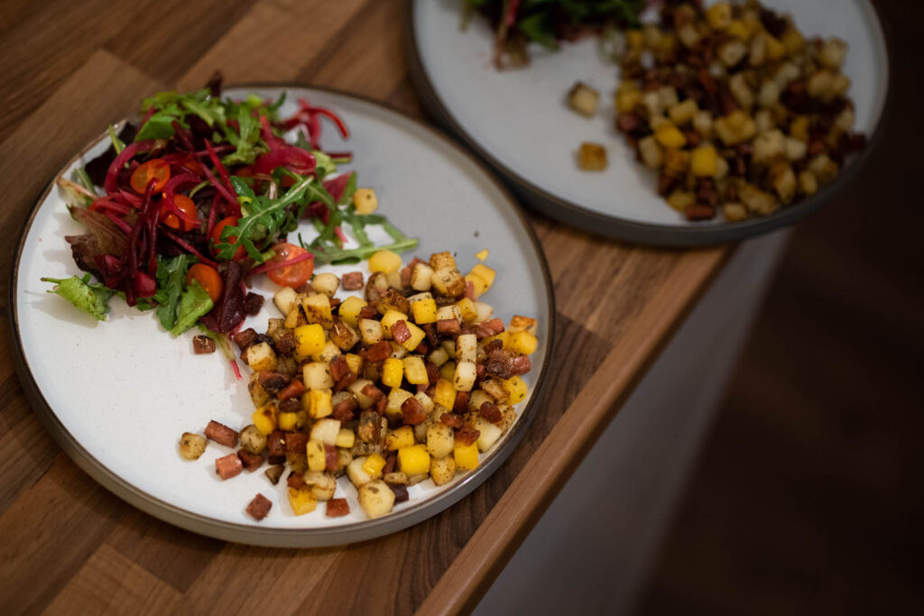 Two plates of Cornish Raw Fry on a table, showcasing a delicious Mother's Day recipe and meal.