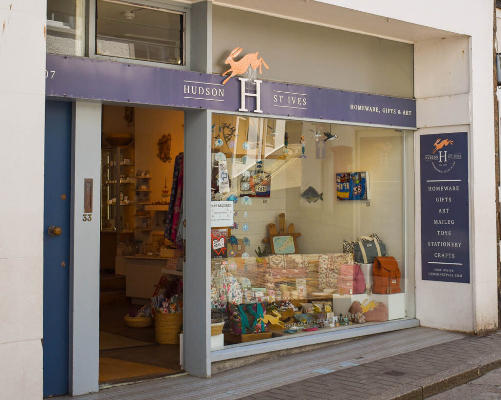 Front view of Hudson in St Ives, an independent shop, featuring a welcoming sign and charming storefront.