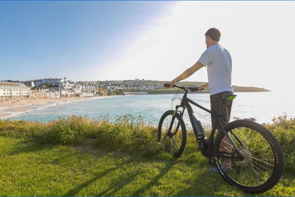 man-on-bike-overlooking-Porthmeor-Beach