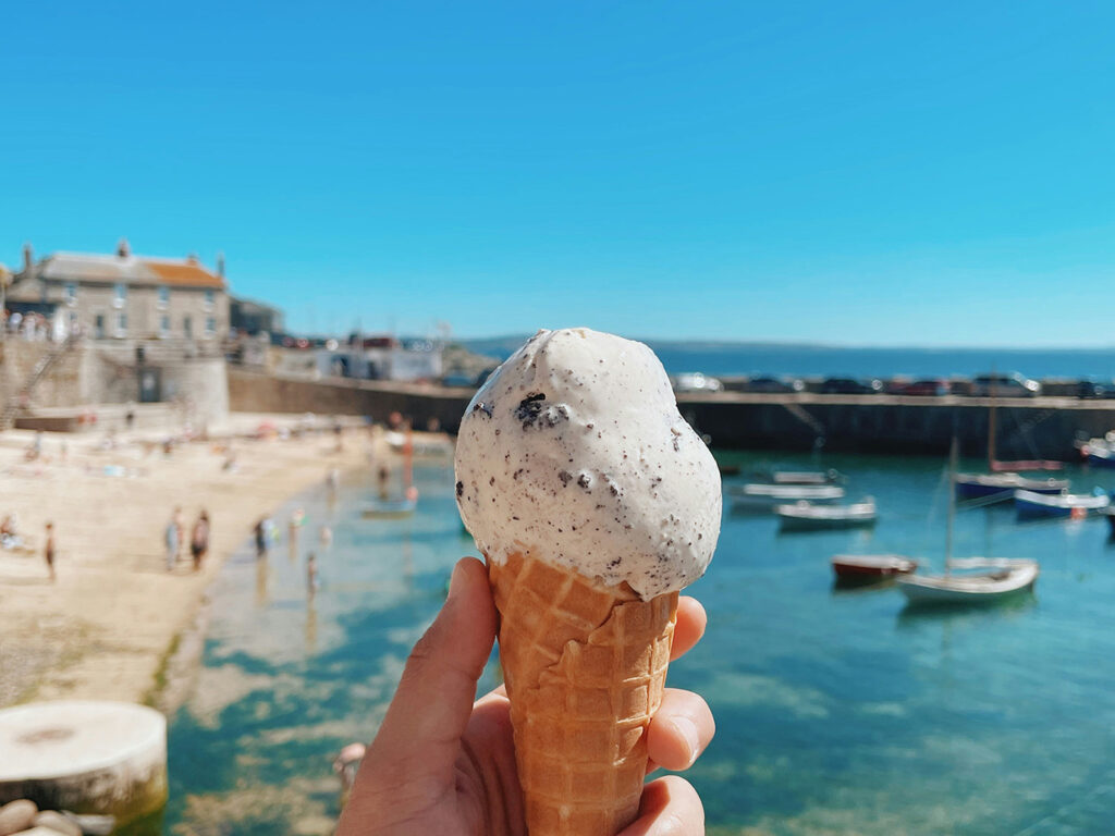 person-holding-an-ice-cream-cone-in-Mousehole