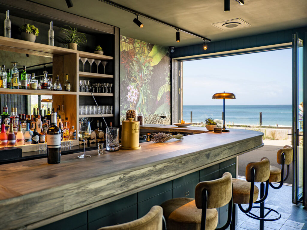 Walter's on the Beach features outdoor seating with a stunning ocean view, perfect for enjoying food and drinks in Carbis Bay.